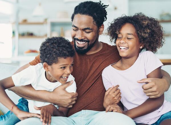 photo of a man with 2 children